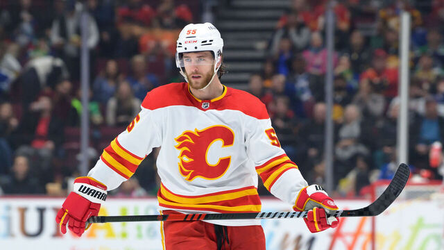 VANCOUVER, CANADA - MARCH 31: Noah Hanifin #55 of the Calgary Flames waits for a face-off during the second period of their NHL game against the Vancouver Canucks at Rogers Arena on March 31, 2023 in Vancouver, British Columbia, Canada.