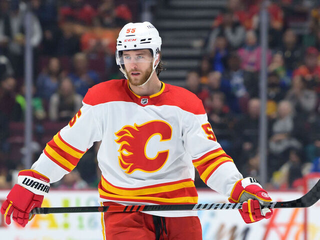 VANCOUVER, CANADA - MARCH 31: Noah Hanifin #55 of the Calgary Flames waits for a face-off during the second period of their NHL game against the Vancouver Canucks at Rogers Arena on March 31, 2023 in Vancouver, British Columbia, Canada.