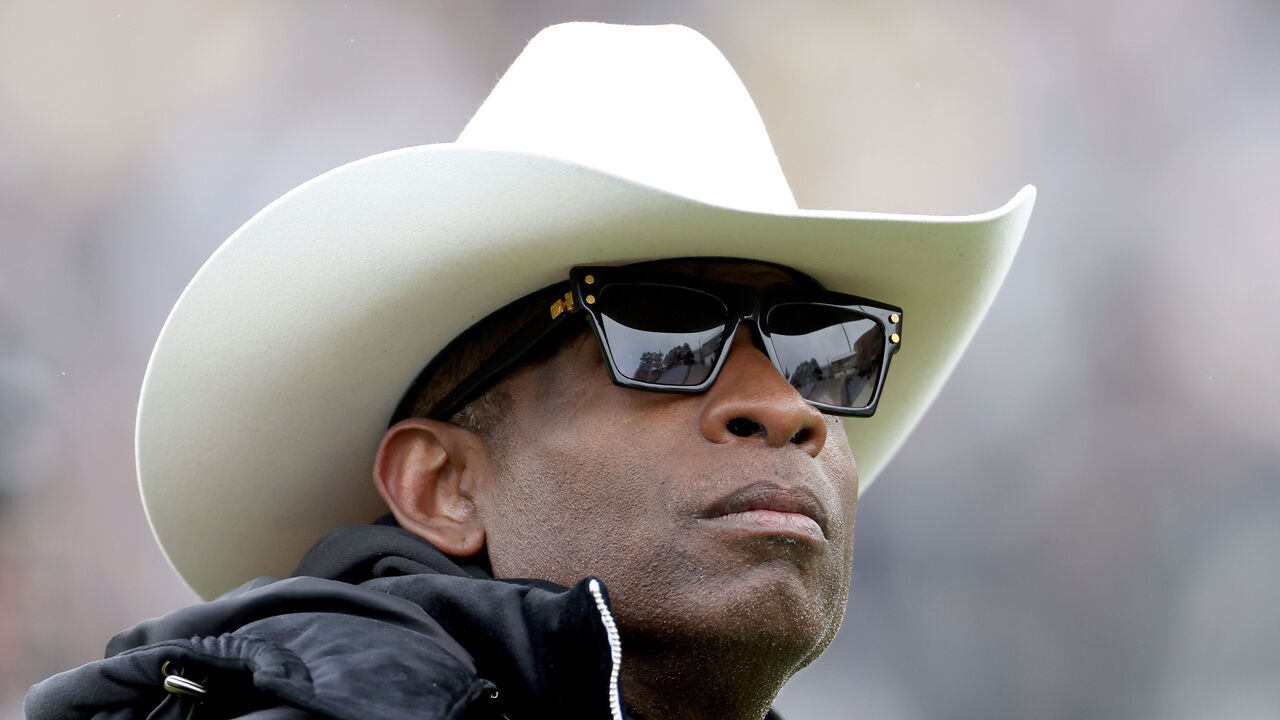 BOULDER, COLORADO - APRIL 22: Head coach Deion Sanders of the Colorado Buffaloes watches as his team warms up prior to their spring game at Folsom Field on April 22, 2023 in Boulder, Colorado.