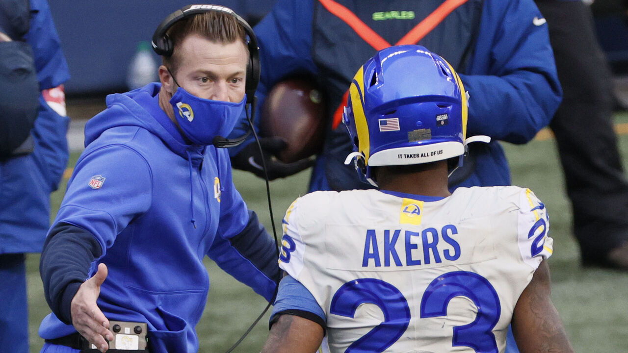 SEATTLE, WASHINGTON - JANUARY 09: Head coach Sean McVay of the Los Angeles Rams congratulates running back Cam Akers #23after he rushed for a touchdown during the second quarter of the NFC Wild Card Playoff game against the Seattle Seahawks at Lumen Field on January 09, 2021 in Seattle, Washington.