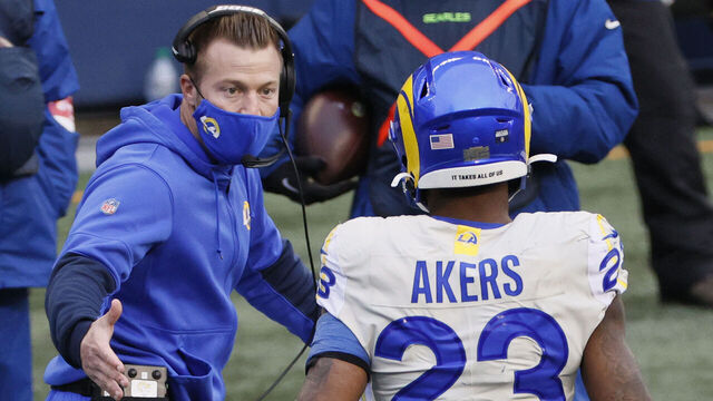 SEATTLE, WASHINGTON - JANUARY 09: Head coach Sean McVay of the Los Angeles Rams congratulates running back Cam Akers #23after he rushed for a touchdown during the second quarter of the NFC Wild Card Playoff game against the Seattle Seahawks at Lumen Field on January 09, 2021 in Seattle, Washington.