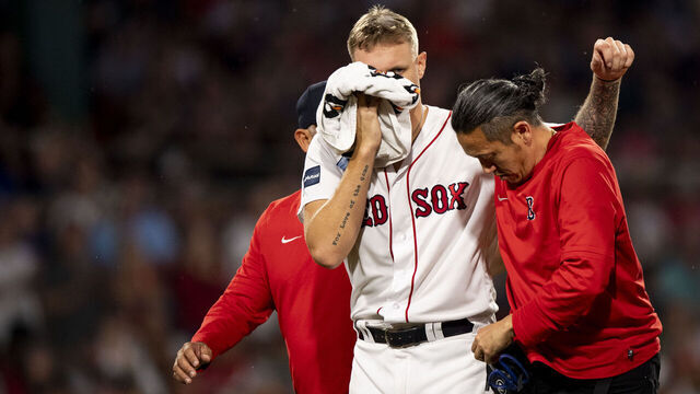 BOSTON, MA - JUNE 16: Tanner Houck #89 of the Boston Red Sox exits the game after being hit in the face with a line drive during the fifth inning against the New York Yankees at Fenway Park on June 16, 2023 in Boston, Massachusetts.