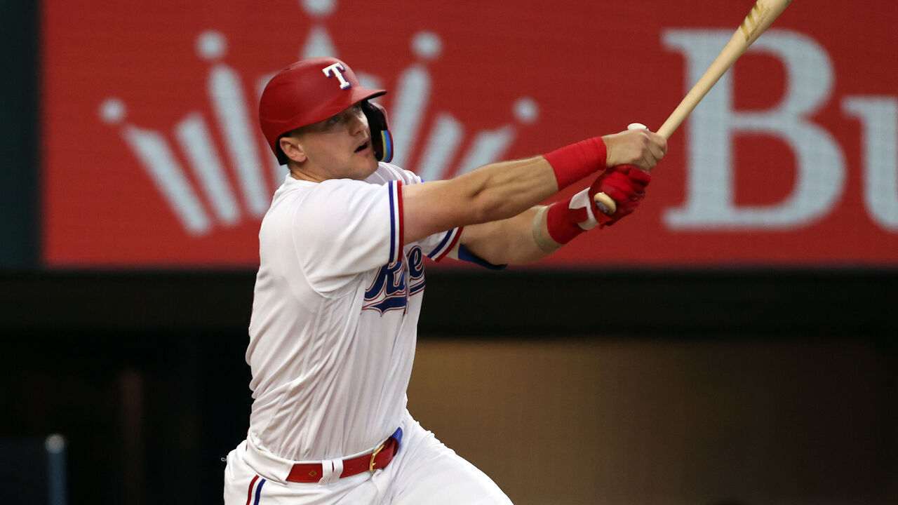 ARLINGTON, TEXAS - JUNE 17: Josh Jung #6 of the Texas Rangers hits a two-run home run against the Toronto Blue Jays in the second inning at Globe Life Field on June 17, 2023 in Arlington, Texas.