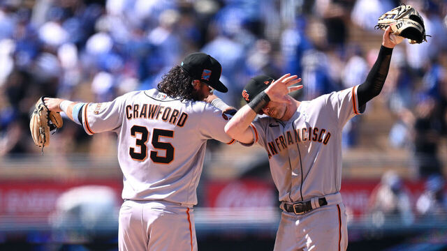 LOS ANGELES, CALIFORNIA - JUNE 18: Brandon Crawford #35 of the San Francisco Giants and Mike Yastrzemski #5 celebrate after defeating the Los Angeles Dodgers 7-3 at Dodger Stadium on June 18, 2023 in Los Angeles, California.