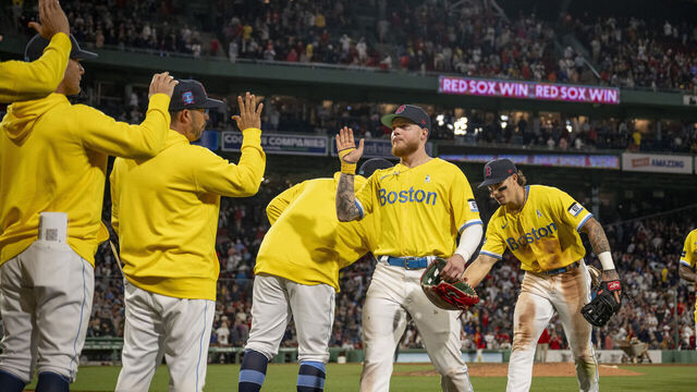 BOSTON, MA - JUNE 18: Boston Red Sox high celebrate winning game two of a doubleheader against the New York Yankees on June 18, 2023 at Fenway Park in Boston, Massachusetts.