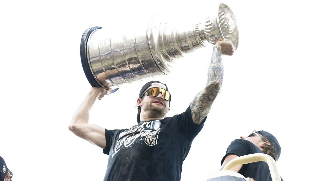 LAS VEGAS, NEVADA - JUNE 17: Adin Hill #33 of the Vegas Golden Knights hoists the Stanley Cup during a victory parade and rally for the Vegas Golden Knights on the Las Vegas Strip on June 17, 2023 in Las Vegas, Nevada. The Golden Knights defeated the Florida Panthers four games to one to win the 2023 NHL Stanley Cup Final.