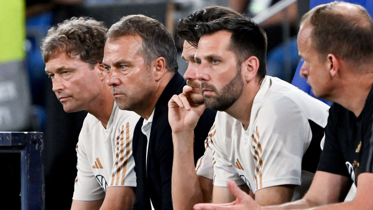 20 June 2023, North Rhine-Westphalia, Gelsenkirchen: Soccer: Internationals, Germany - Colombia, Veltins Arena. National coach Hansi Flick (2nd from left) and his assistants follow the match. IMPORTANT NOTE: In accordance with the regulations of the DFL Deutsche Fußball Liga and the DFB Deutscher Fußball-Bund, it is prohibited to use or have used photographs taken in the stadium and/or of the match in the form of sequence pictures and/or video-like photo series. Photo: Federico Gambarini/dpa