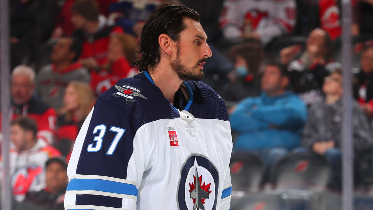 NEWARK, NJ - FEBRUARY 19: A helmetless Connor Hellebuyck #37 of the Winnipeg Jets prior to the game against the New Jersey Devils on February 19, 2023 at the Prudential Center in Newark, New Jersey.