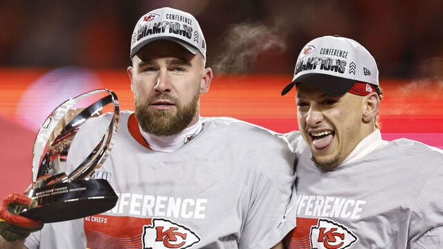KANSAS CITY, MISSOURI - JANUARY 29: Travis Kelce #87 of the Kansas City Chiefs and Patrick Mahomes #15 of the Kansas City Chiefs celebrate with the Lamar Hunt Trophy after winning the AFC Championship NFL football game between the Kansas City Chiefs and the Cincinnati Bengals at GEHA Field at Arrowhead Stadium on January 29, 2023 in Kansas City, Missouri.