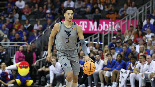 KANSAS CITY, MO - MARCH 09: West Virginia Mountaineers forward Tre Mitchell (3) brings the ball up court in the second half of a Big 12 Tournament quarterfinal basketball game between the West Virginia Mountaineers and the Kansas Jayhawks on March 9, 2023 at T-Mobile Center in Kansas City, MO.