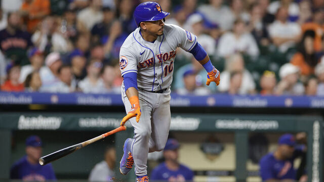 HOUSTON, TEXAS - JUNE 20: Eduardo Escobar #10 of the New York Mets hits an RBI single during the eighth inning against the Houston Astros at Minute Maid Park on June 20, 2023 in Houston, Texas.