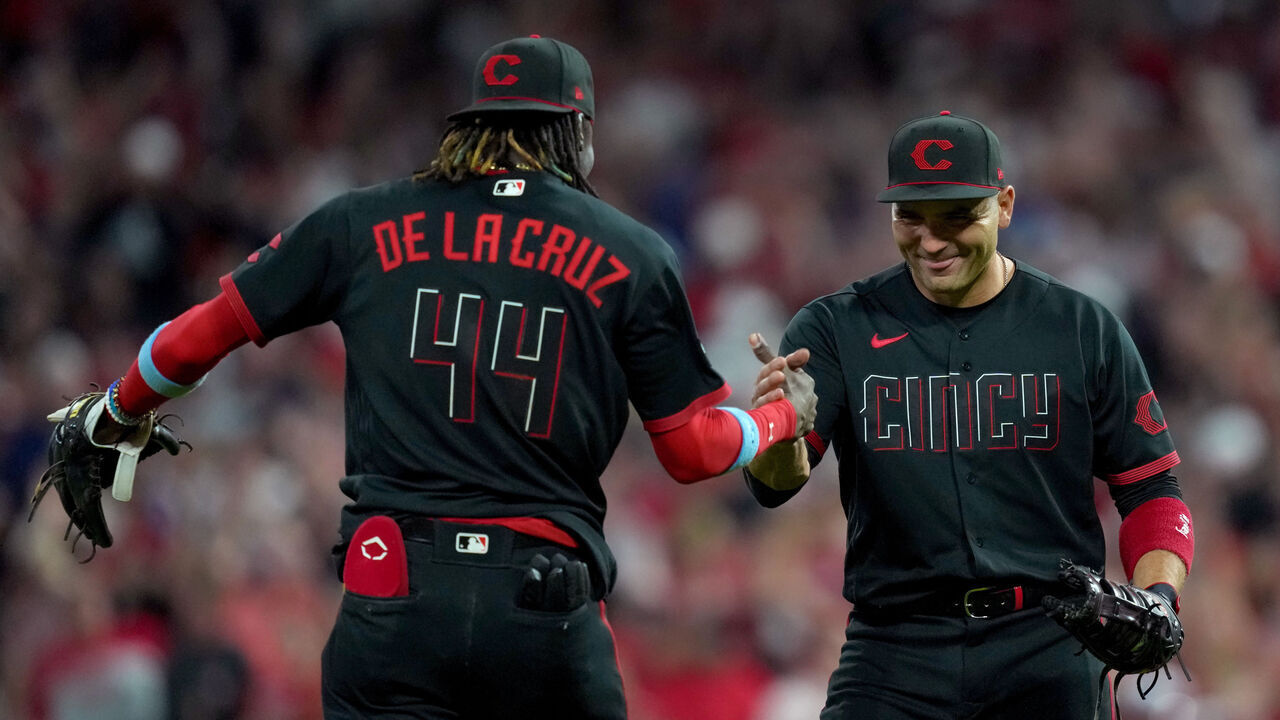 CINCINNATI, OHIO - JUNE 23: Elly De La Cruz #44 and Joey Votto #19 of the Cincinnati Reds celebrate after beating the Atlanta Braves 11-10 at Great American Ball Park on June 23, 2023 in Cincinnati, Ohio.