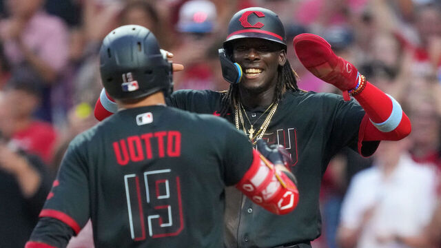 CINCINNATI, OHIO - JUNE 23: Joey Votto #19 and Elly De La Cruz #44 of the Cincinnati Reds celebrate after Votto hit a home run in the fifth inning against the Atlanta Braves at Great American Ball Park on June 23, 2023 in Cincinnati, Ohio.