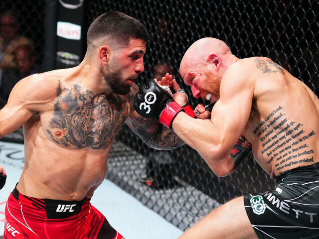 JACKSONVILLE, FLORIDA - JUNE 24: (L-R) Ilia Topuria of Germany punches Josh Emmett in their featherweight fight during the UFC Fight Night event at Vystar Veterans Memorial Arena on June 24, 2023 in Jacksonville, Florida.