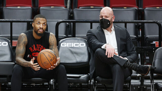 PORTLAND, OREGON - DECEMBER 17: Interim general manager Joe Cronin talks with Damian Lillard # 0 of the Portland Trail Blazers prior to the game against the Charlotte Hornets at Moda Center on December 17, 2021 in Portland, Oregon.
