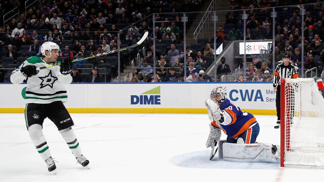 ELMONT, NEW YORK - JANUARY 10: Jason Robertson #21 of the Dallas Stars scores the game-winning shootout goal against Ilya Sorokin #30 of the New York Islanders at the UBS Arena on January 10, 2023 in Elmont, New York. The Stars defeated the Islanders 2-1 in the shootout.