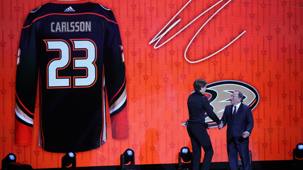 NASHVILLE, TN - JUNE 28: NHL commissioner Gary Bettman shakes hands with Leo Carlsson, second overall pick of the Anaheim Ducks during the first round of the Upper Deck NHL Draft, June 28, 2023 at Bridgestone Arena in Nashville, Tennessee.