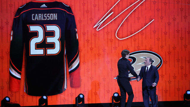 NASHVILLE, TN - JUNE 28: NHL commissioner Gary Bettman shakes hands with Leo Carlsson, second overall pick of the Anaheim Ducks during the first round of the Upper Deck NHL Draft, June 28, 2023 at Bridgestone Arena in Nashville, Tennessee.