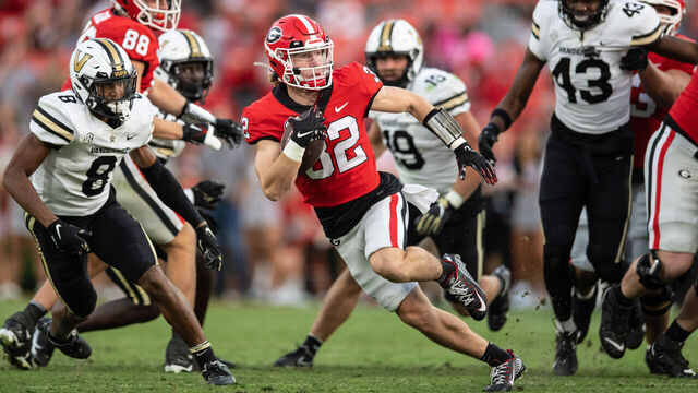 ATHENS, GA - OCTOBER 15: Cash Jones #32 of the Georgia Bulldogs scores a touchdown against the Vanderbilt Commodores during the fourth quarter at Sanford Stadium on October 15, 2022 in Athens, Georgia.