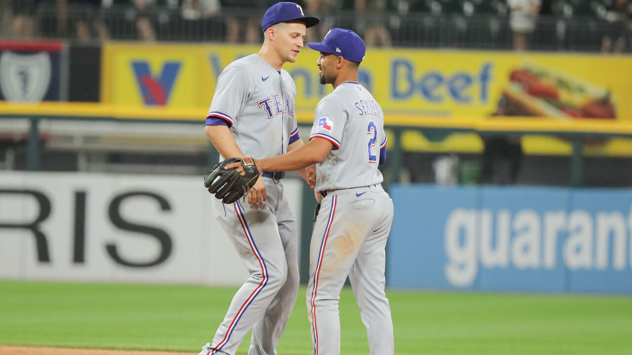 CHICAGO, IL - JUNE 19: Texas Rangers shortstop Corey Seager (5) greets Texas Rangers second baseman Marcus Semien (2) after a Major League Baseball game between the Texas Rangers and the Chicago White Sox on June 19, 2023 at Guaranteed Rate Field in Chicago, IL.