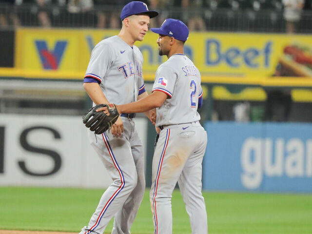 CHICAGO, IL - JUNE 19: Texas Rangers shortstop Corey Seager (5) greets Texas Rangers second baseman Marcus Semien (2) after a Major League Baseball game between the Texas Rangers and the Chicago White Sox on June 19, 2023 at Guaranteed Rate Field in Chicago, IL.