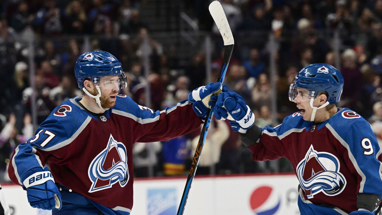 DENVER, CO - DECEMBER 31: Colorado Avalanche left wing J.T. Compher (37) and Colorado Avalanche center Evan Rodrigues (9) celebrate after Comphers goal against the Toronto Maple Leafs in the first period at Ball Arena December 31, 2022.