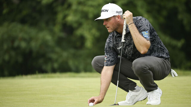DETROIT, MICHIGAN - JUNE 30: Taylor Pendrith of Canada lines up a putt on the third green during the second round of the Rocket Mortgage Classic at Detroit Golf Club on June 30, 2023 in Detroit, Michigan.