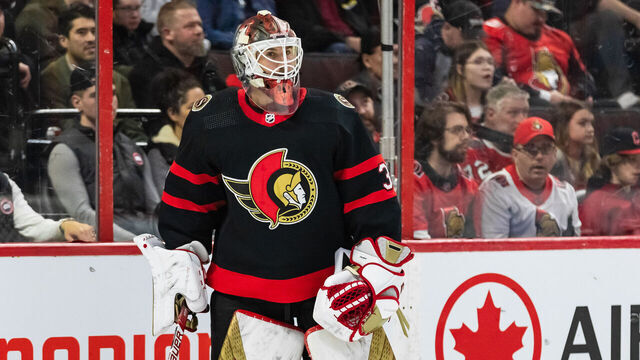 OTTAWA, ON - APRIL 08: Ottawa Senators Goalie Cam Talbot (33) plays the puck during first period National Hockey League action between the Tampa Bay Lightning and Ottawa Senators on April 8, 2023, at Canadian Tire Centre in Ottawa, ON, Canada.