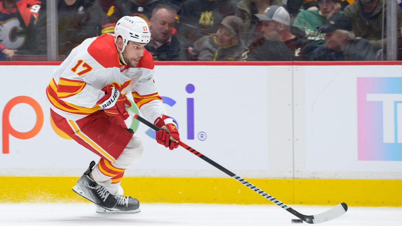 VANCOUVER, CANADA - MARCH 31: Milan Lucic #17 of the Calgary Flames skates with the puck during the third period of their NHL game against the Vancouver Canucks at Rogers Arena on March 31, 2023 in Vancouver, British Columbia, Canada.