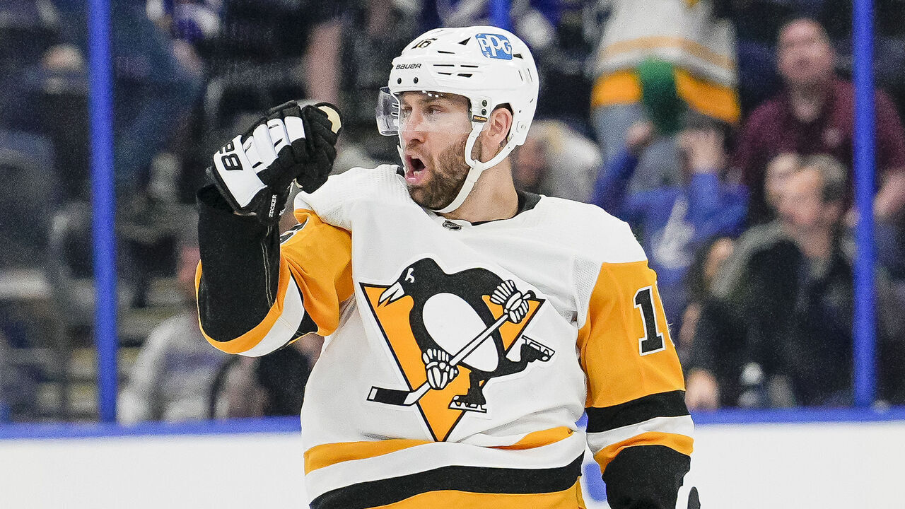 TAMPA, FL - MARCH 02: Pittsburgh Penguins left wing Jason Zucker (16) scores the Winning goal in OT during the NHL Hockey match between the Tampa Bay Lightning and Pittsburgh Penguins on March 2nd, 2023 at Amalie Arena in Tampa, FL.