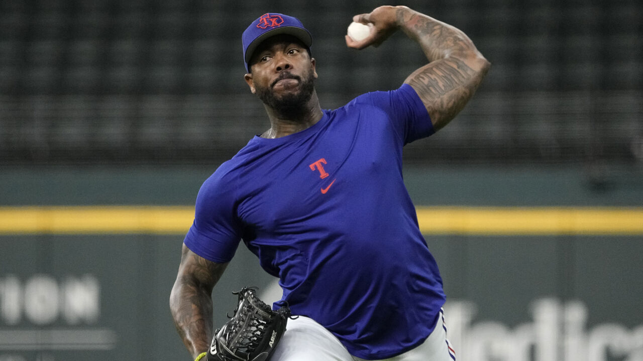 ARLINGTON, TEXAS - JULY 01: Aroldis Chapman #45 of the Texas Rangers throws on the field before the game against the Houston Astros at Globe Life Field on July 01, 2023 in Arlington, Texas.