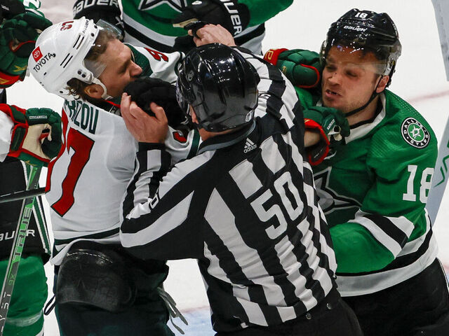 DALLAS, TX - APRIL 19: Minnesota Wild left wing Kirill Kaprizov (97) and Dallas Stars center Max Domi (18) get into a scuffle during the game between the Dallas Stars and the Minnesota Wild on April 19, 2023 at American Airlines Center in Dallas, Texas.