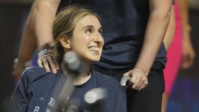 FLUSHING, NY - JUNE 02: Sarah Langs on the field to help recognize ALS Lous Gehrig Day prior to the Major League Baseball game between the Toronto Blue Jays and New York Mets on June 2, 2023, at Citi Field in Flushing, NY.