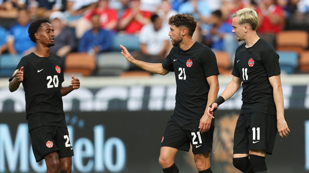 HOUSTON, TX - JULY 04: Jonathan Osorio #21 of Canada celebrates with his teammates after scoring the second goal of his team during match between Canada and Cuba as part of the 2023 CONCACAF Gold Cup at Shell Energy Stadium on July 4, 2023 in Houston, Texas.