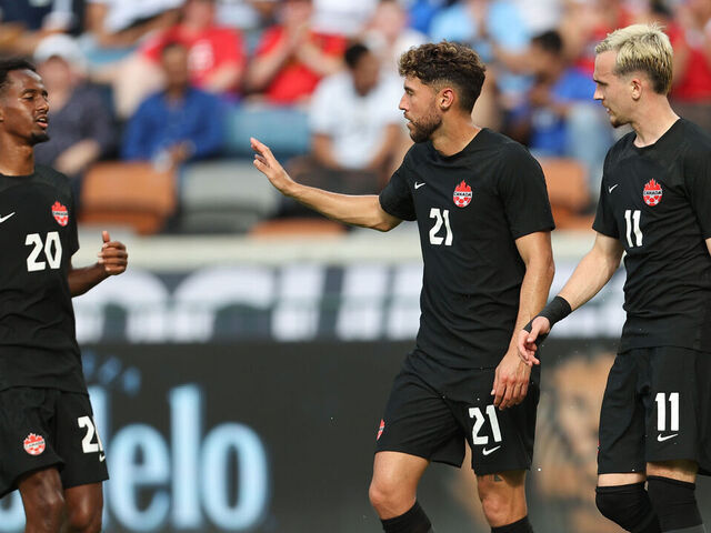 HOUSTON, TX - JULY 04: Jonathan Osorio #21 of Canada celebrates with his teammates after scoring the second goal of his team during match between Canada and Cuba as part of the 2023 CONCACAF Gold Cup at Shell Energy Stadium on July 4, 2023 in Houston, Texas.