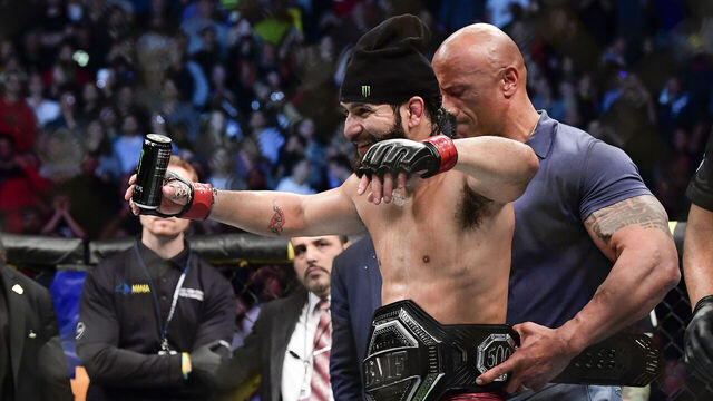 NEW YORK, NEW YORK - NOVEMBER 02: Jorge Masvidal of the United States is awarded the belt by Dwayne "the Rock" Johnson after his victory by TKO on a medical stoppage against Nate Diaz of the United States in the Welterweight "BMF" championship bout during UFC 244 at Madison Square Garden on November 02, 2019 in New York City.
