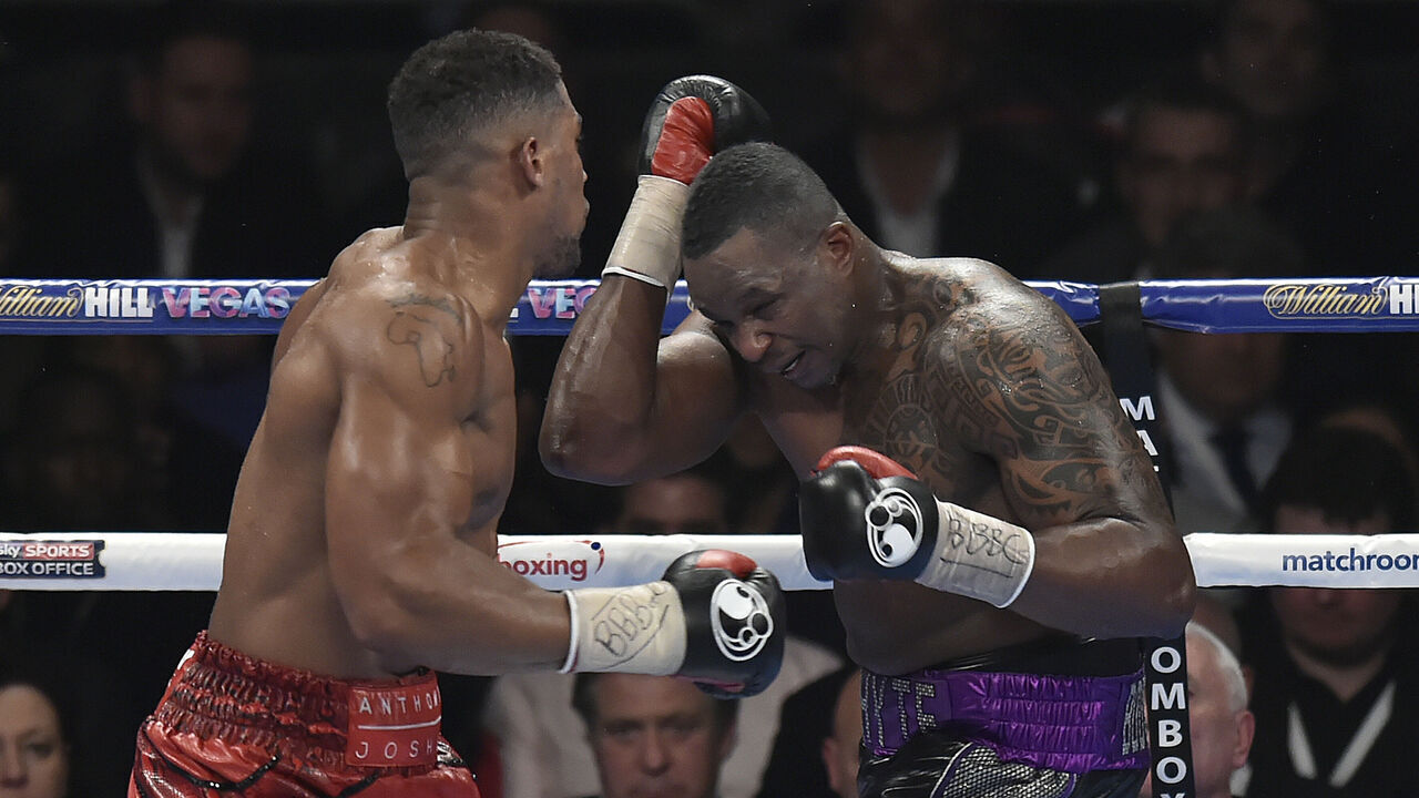 LONDON, ENGLAND - DECEMBER 12: Anthony Joshua MBE (L) boxes Dillian Whyte for the Commonwealth Heavyweight title, Vacant British Heavyweight title and WBC International Heavyweight title at The O2 Arena on December 12, 2015 in London, England. *** Local Caption ***Anthony Joshua MBE; Dillian Whyte