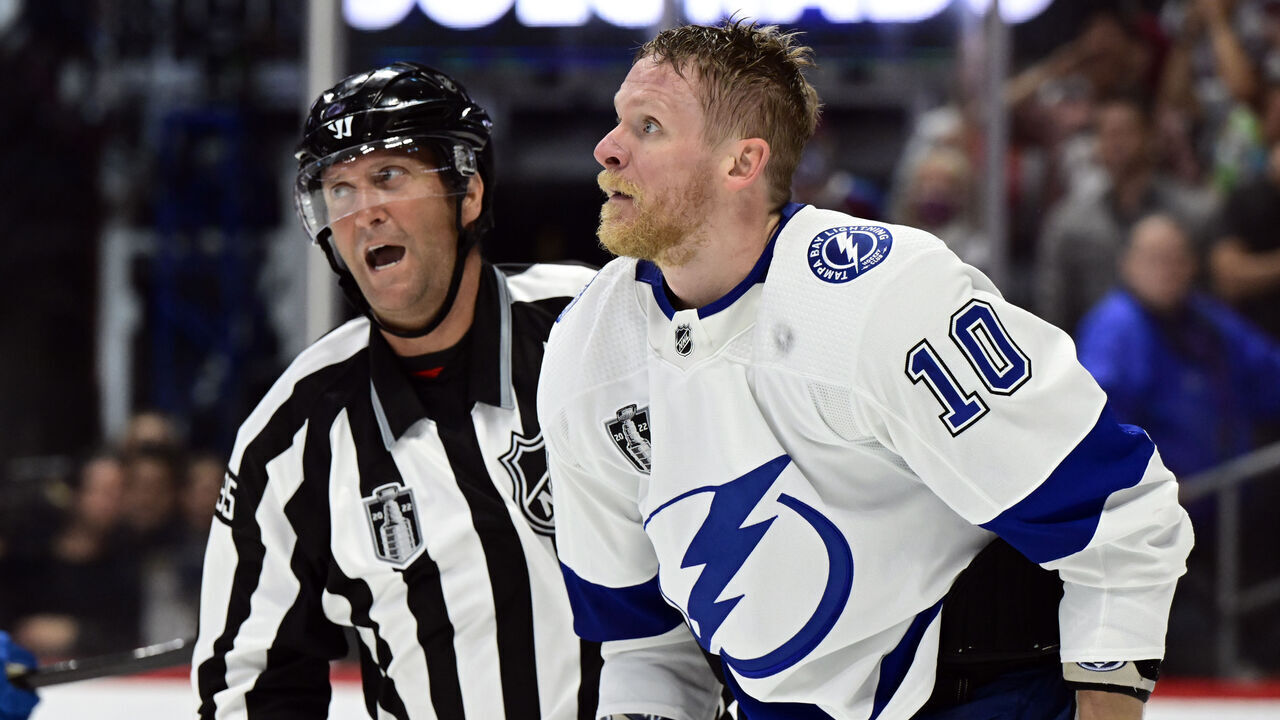 DENVER, CO - JUNE 18: Corey Perry (10) of the Tampa Bay Lightning skates off the ice in front of linesman Jonny Murray (95) after getting into a fight with J.T. Compher (37) of the Colorado Avalanche during the second period of Game 2 in the 2022 NHL Stanley Cup Finals as the Colorado Avalanche play against the Tampa Bay Lightning at Ball Arena on Saturday, June 18, 2022. Compher received a hooking penalty and Perry received two penalties, roughing and an unsportsmanlike conduct.