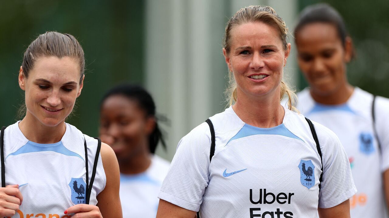 France's midfielder Lea Le Garrec (L) and France's midfielder Amandine Henry arrive for a training session in Clairefontaine-en-Yvelines, on June 21, 2023, as part of the team's preparation for the upcoming FIFA Women's World Cup in Australia and New Zealand.