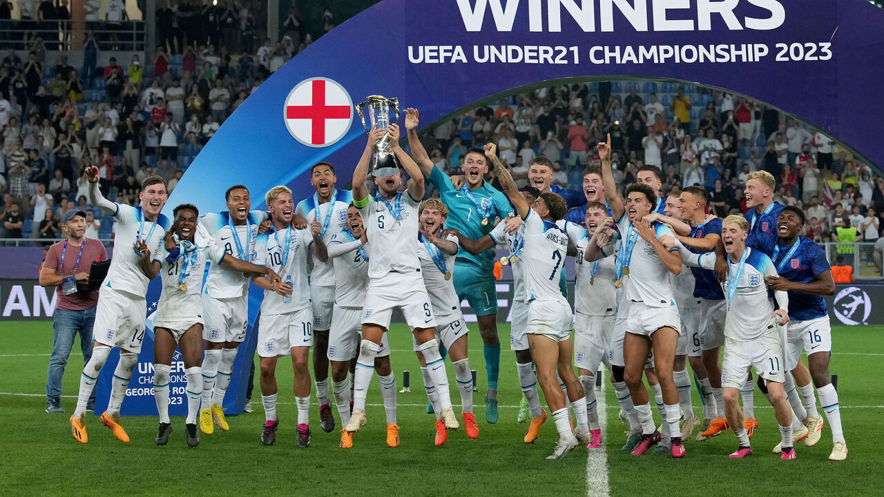 BATUMI, GEORGIA - JULY 08: Taylor Harwood-Bellis of England lifts the Trophy after winning the UEFA Under-21 Euro 2023 final match between England and Spain at Batumi Arena on July 08, 2023 in Batumi, Georgia.