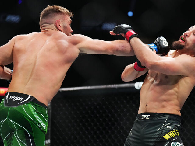LAS VEGAS, NEVADA - JULY 08: (L-R) Dricus Du Plessis of South Africa punches Robert Whittaker of New Zealand in a middleweight fight during the UFC 290 event at T-Mobile Arena on July 08, 2023 in Las Vegas, Nevada.