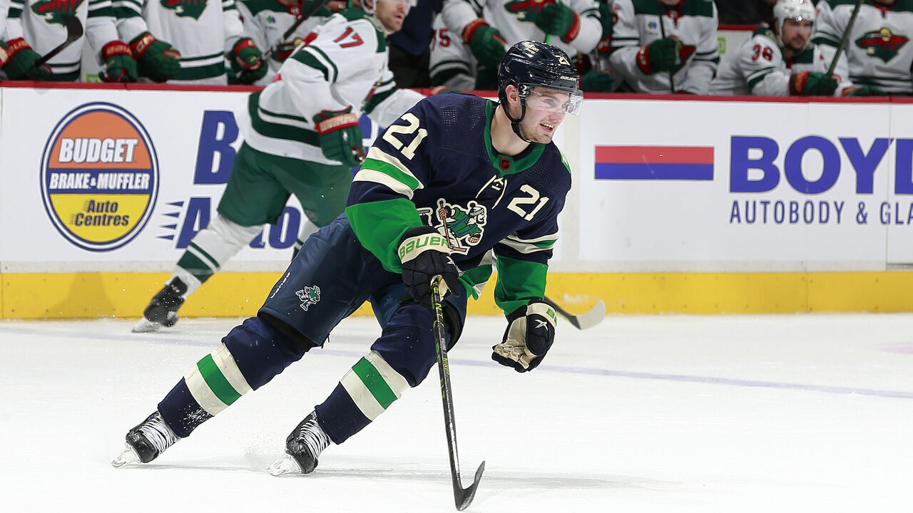 VANCOUVER, CANADA - DECEMBER 10: Nils Hoglander #21 of the Vancouver Canucks skates up ice during their NHL game against the Minnesota Wild at Rogers Arena December 10, 2022 in Vancouver, British Columbia, Canada.