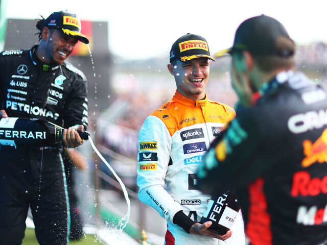 NORTHAMPTON, ENGLAND - JULY 09: Race winner, Max Verstappen of the Netherlands and Oracle Red Bull Racing, Second placed Lando Norris of Great Britain and McLaren celebrates with third placed Lewis Hamilton of Great Britain and Mercedes on the podium during the F1 Grand Prix of Great Britain at Silverstone Circuit on July 09, 2023 in Northampton, England.