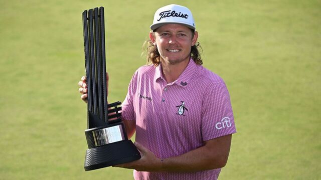 Australia's Cameron Smith poses on the 18th green with the winner's trophy on the final day of the LIV Golf Invitational Series event at The Centurion Club in St Albans, north of London, on July 9, 2023.