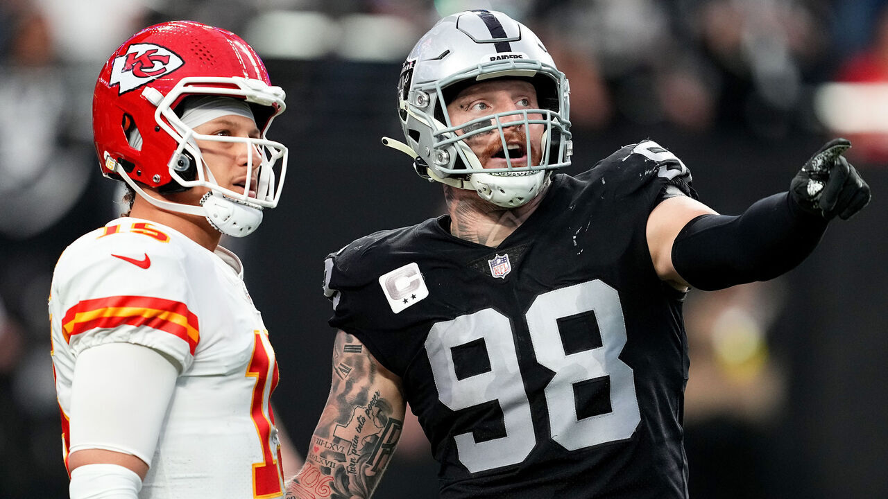 LAS VEGAS, NEVADA - JANUARY 07: Patrick Mahomes #15 of the Kansas City Chiefs and Maxx Crosby #98 of the Las Vegas Raiders talk on the field during the first half of the game at Allegiant Stadium on January 07, 2023 in Las Vegas, Nevada.