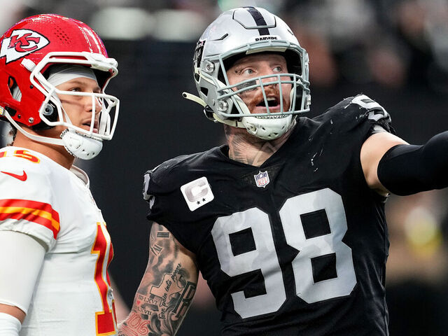LAS VEGAS, NEVADA - JANUARY 07: Patrick Mahomes #15 of the Kansas City Chiefs and Maxx Crosby #98 of the Las Vegas Raiders talk on the field during the first half of the game at Allegiant Stadium on January 07, 2023 in Las Vegas, Nevada.