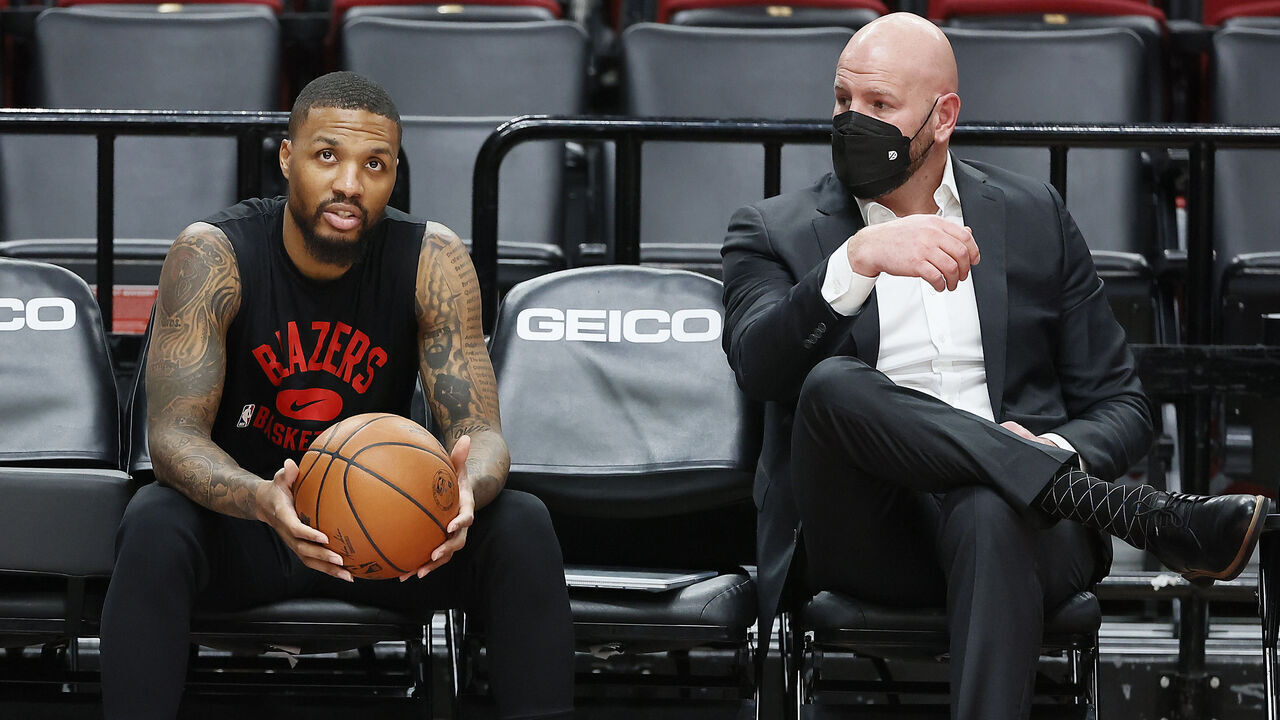 PORTLAND, OREGON - DECEMBER 17: Interim general manager Joe Cronin talks with Damian Lillard # 0 of the Portland Trail Blazers prior to the game against the Charlotte Hornets at Moda Center on December 17, 2021 in Portland, Oregon.