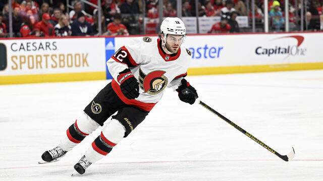 WASHINGTON, DC - DECEMBER 29: Alex DeBrincat #12 of the Ottawa Senators skates down the ice against the Washington Capitals at Capital One Arena on December 29, 2022 in Washington, DC.