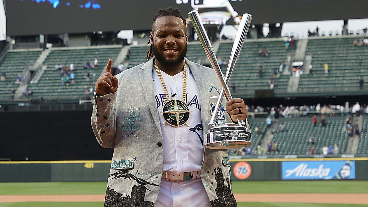 SEATTLE, WASHINGTON - JULY 10: Vladimir Guerrero Jr. #27 of the Toronto Blue Jays poses for photos with his trophy after winning the T-Mobile Home Run Derby at T-Mobile Park on July 10, 2023 in Seattle, Washington.