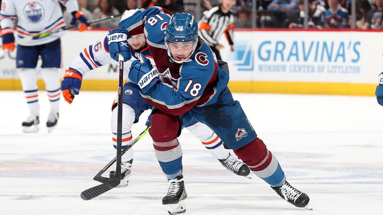 DENVER, COLORADO - APRIL 11: Alex Newhook #18 of the Colorado Avalanche skates against the Edmonton Oilers at Ball Arena on April 11, 2023 in Denver, Colorado.
